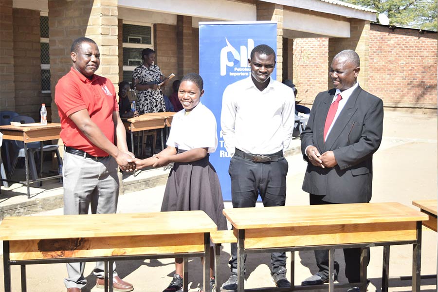 Pingani hands over desks at Mtakataka CDSS